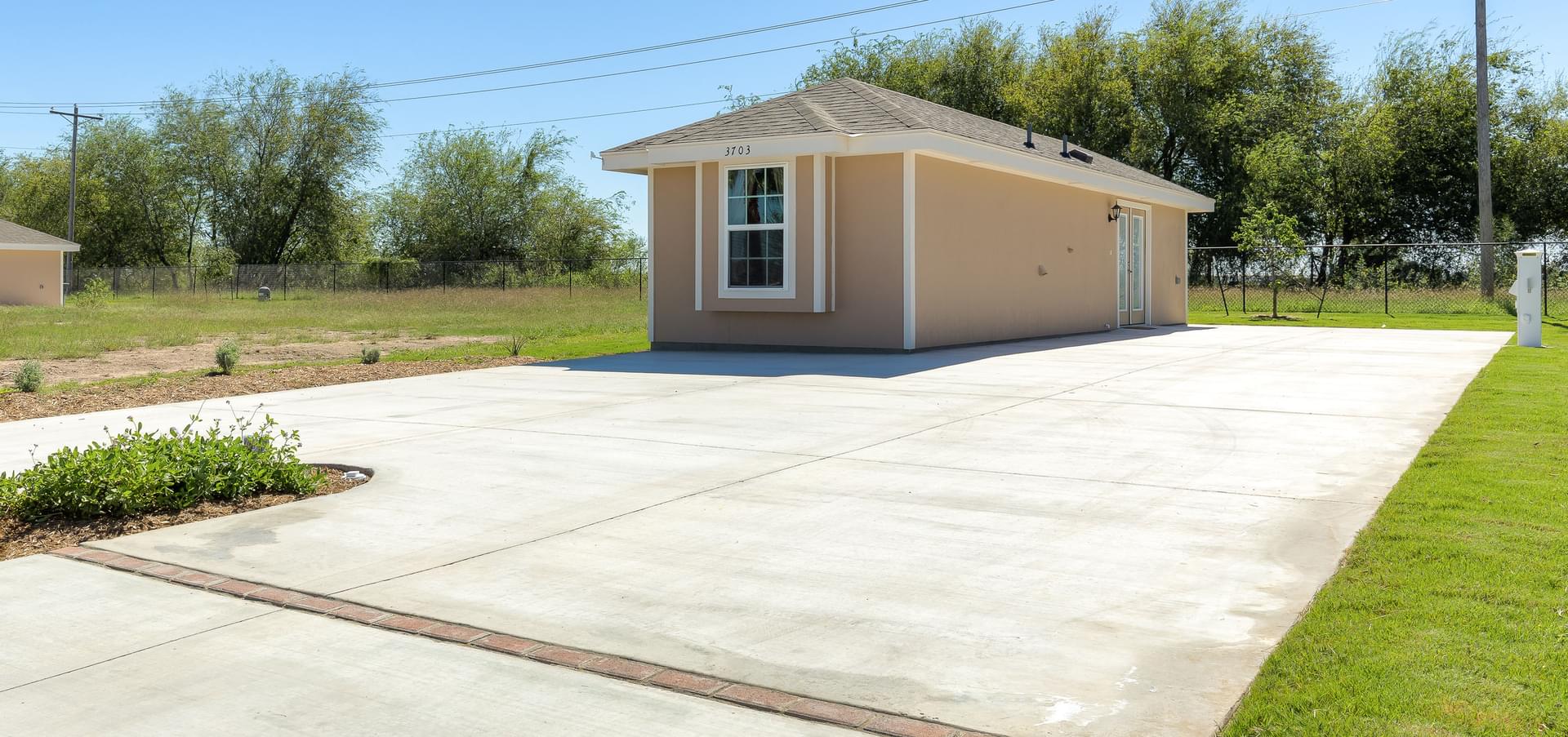 The RV Deluxe Coach House New Home in Mission, TX Retama Village (55+) at Bentsen Palm from