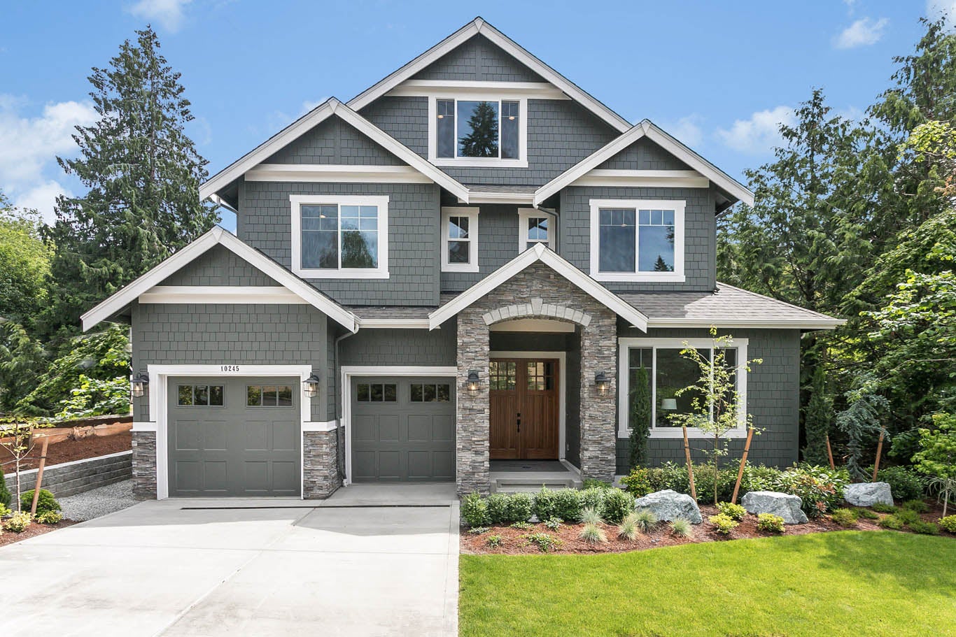 Gray house with white trim and stone accents