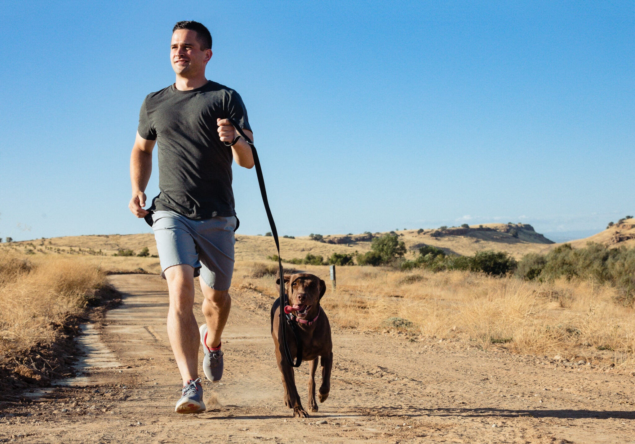 Walking a trail with dog in Tesoro Viejo