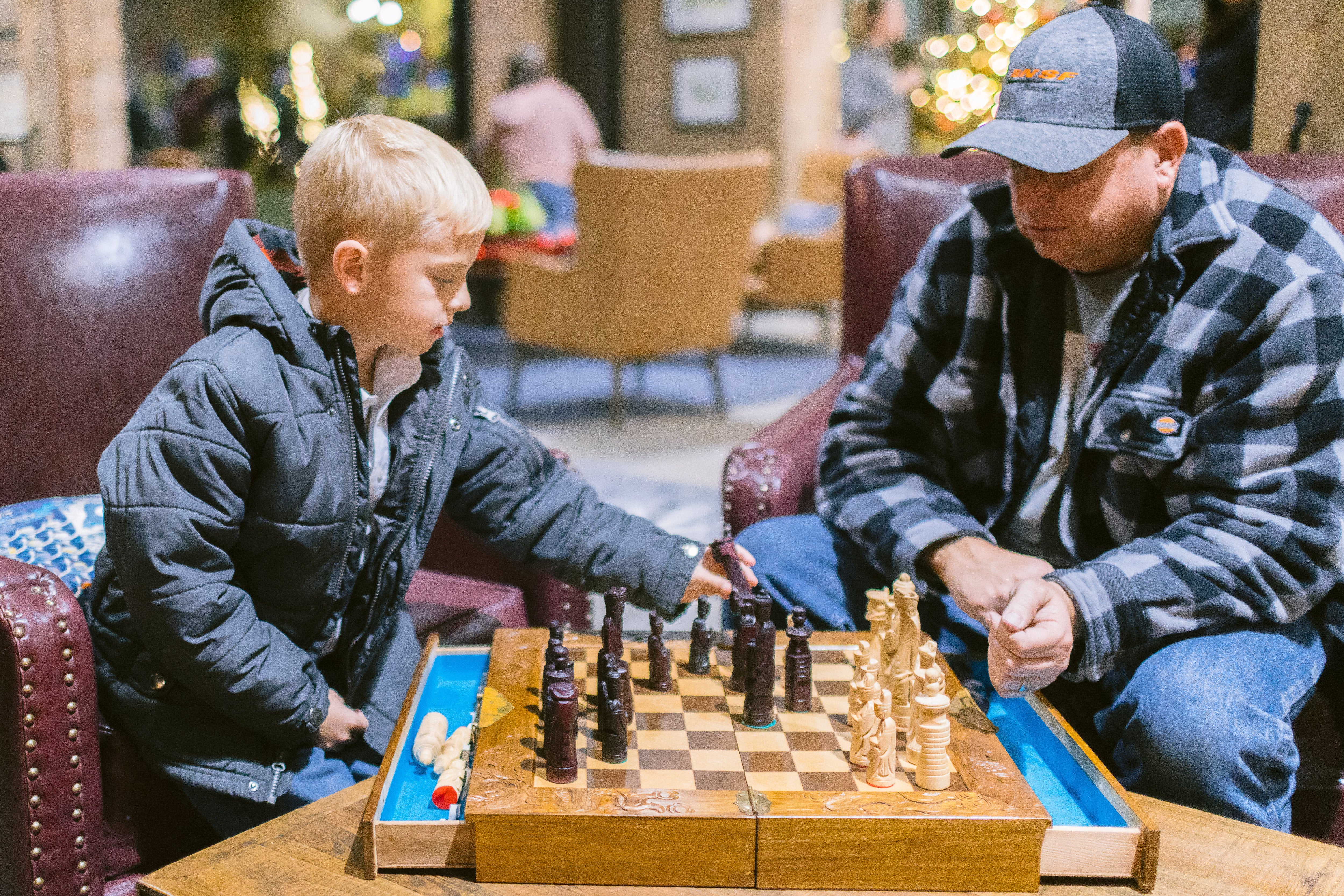Father and son playing checkers at 