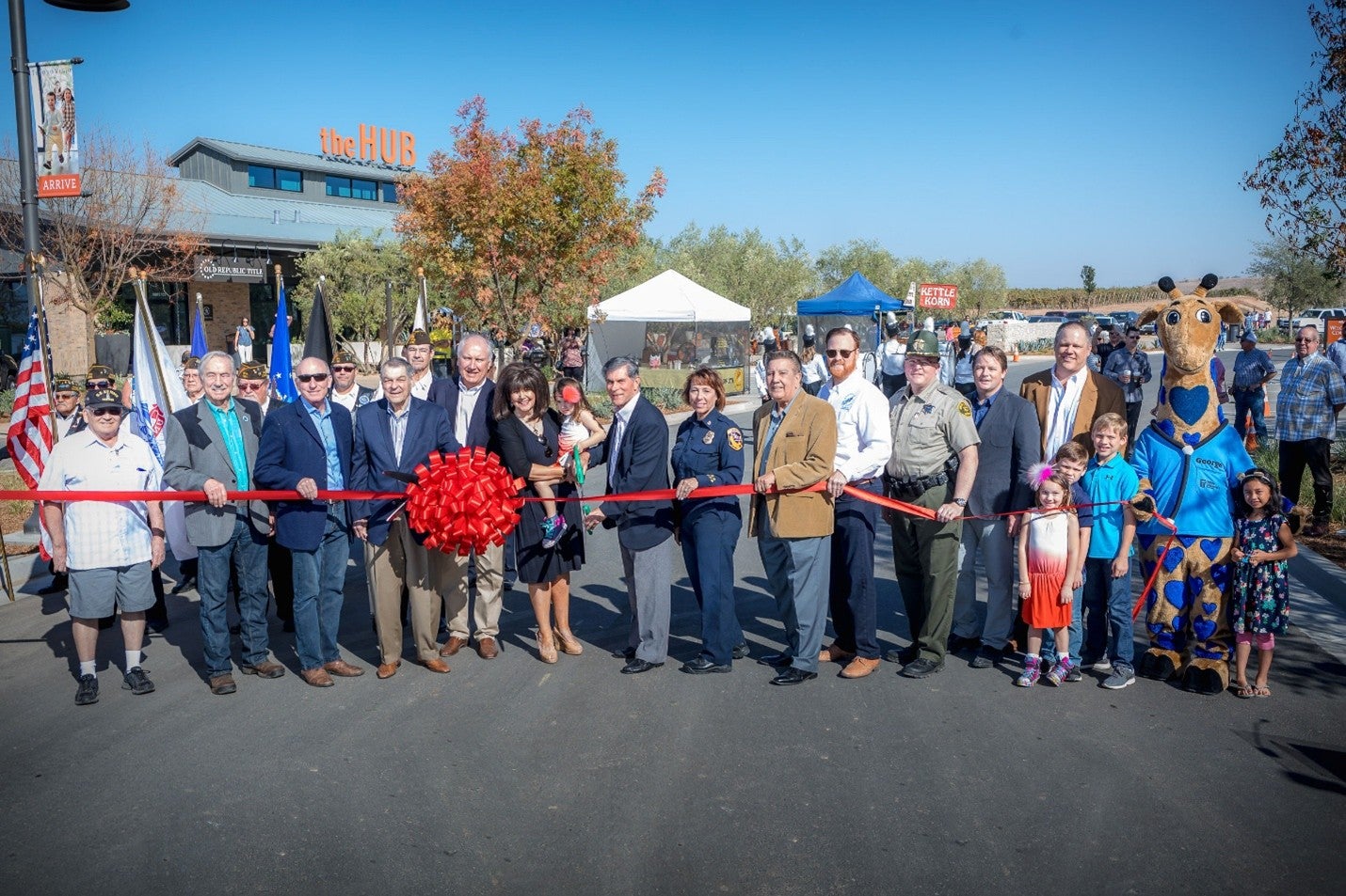 Bill Lyles (4th from left) joined members of the Lyles family, McCaffrey family, and community leaders to celebrate the official Tesoro Viejo ribbon cutting ceremony on October 20, 2018