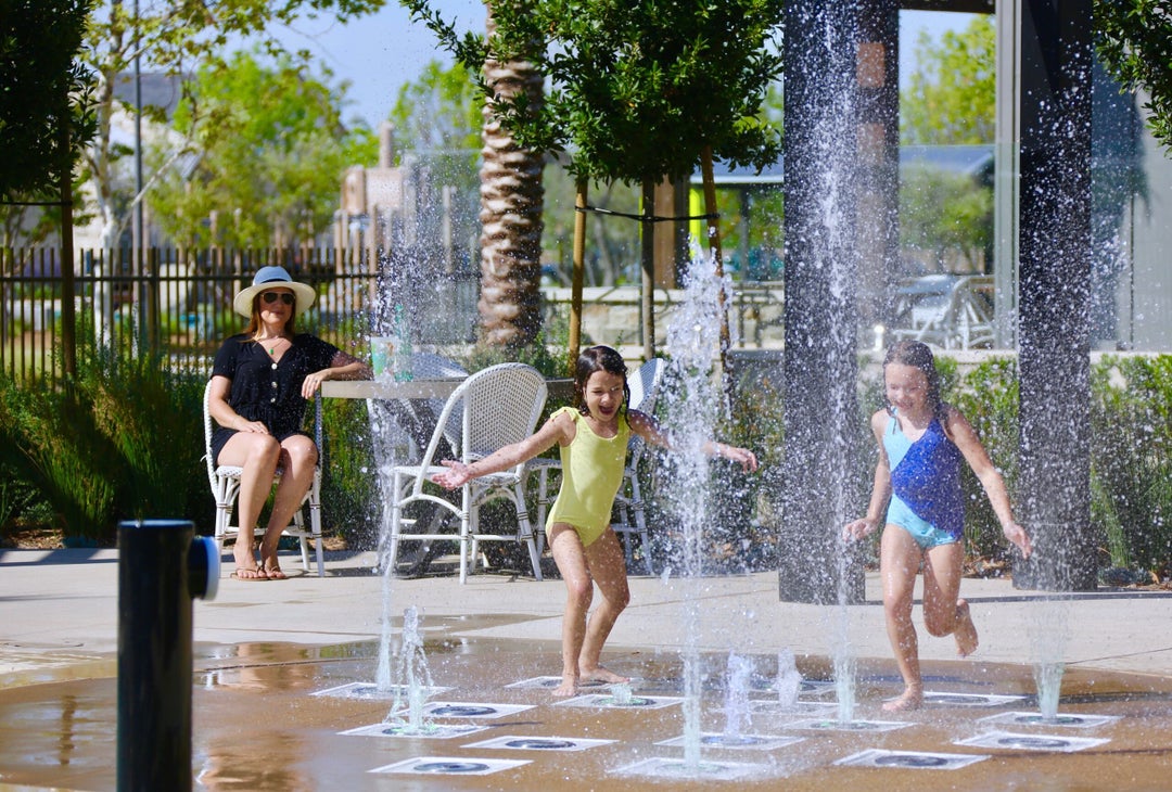 Kids enjoy the splash zone at the Ranch House community clubhouse