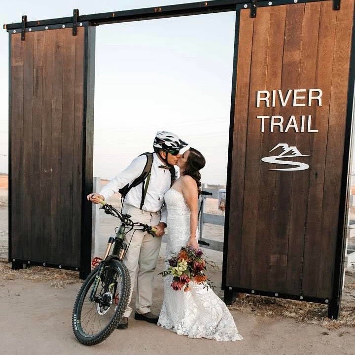 Guests at their wedding either hiked or rode mountain bikes from the Kissing Gate to the ceremony.
