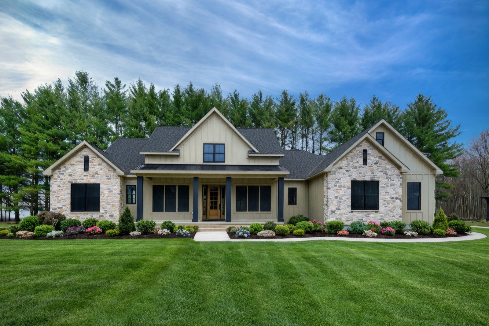 Michigan stone veneer on a Cobblestone Homes custom home exterior in Midland, Michigan