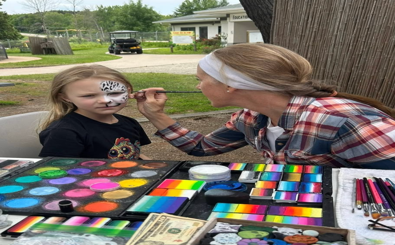 Face painting at a Banner Built Homes fall festival
