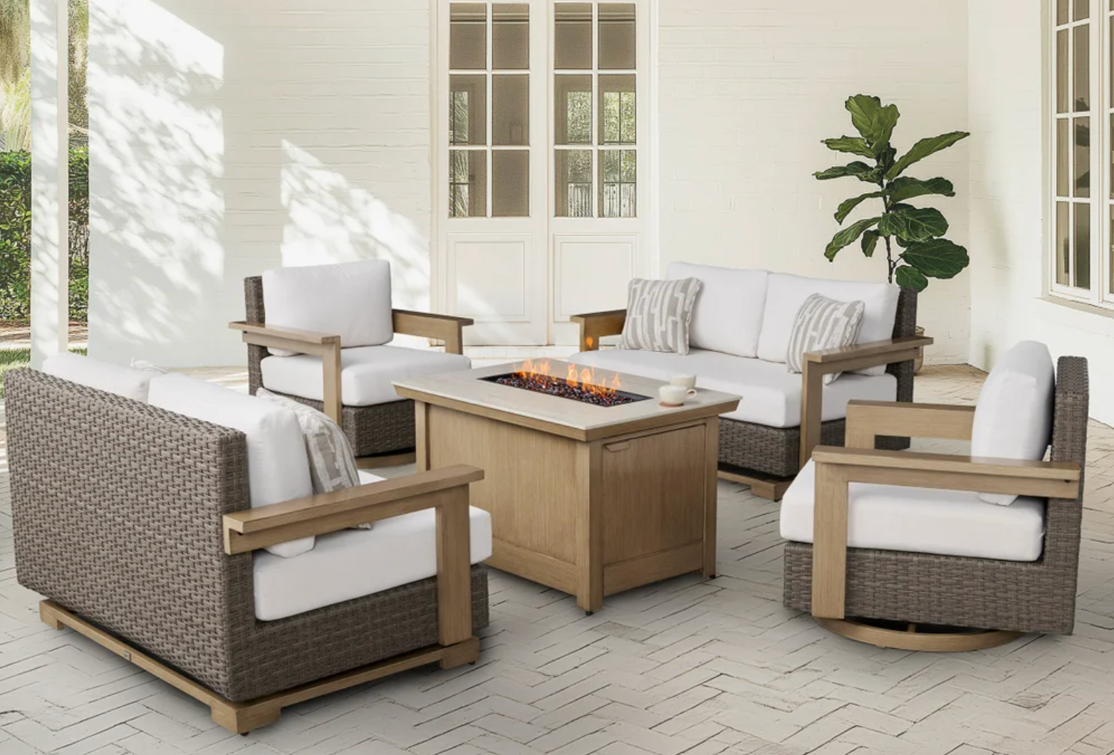 Friends enjoying patio furniture on a Legacy South covered porch