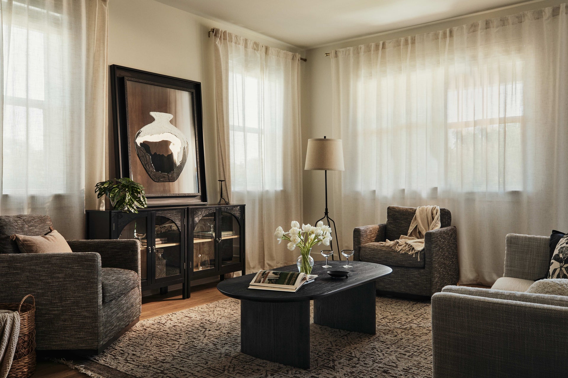 Living area with floor-to-ceiling drapery